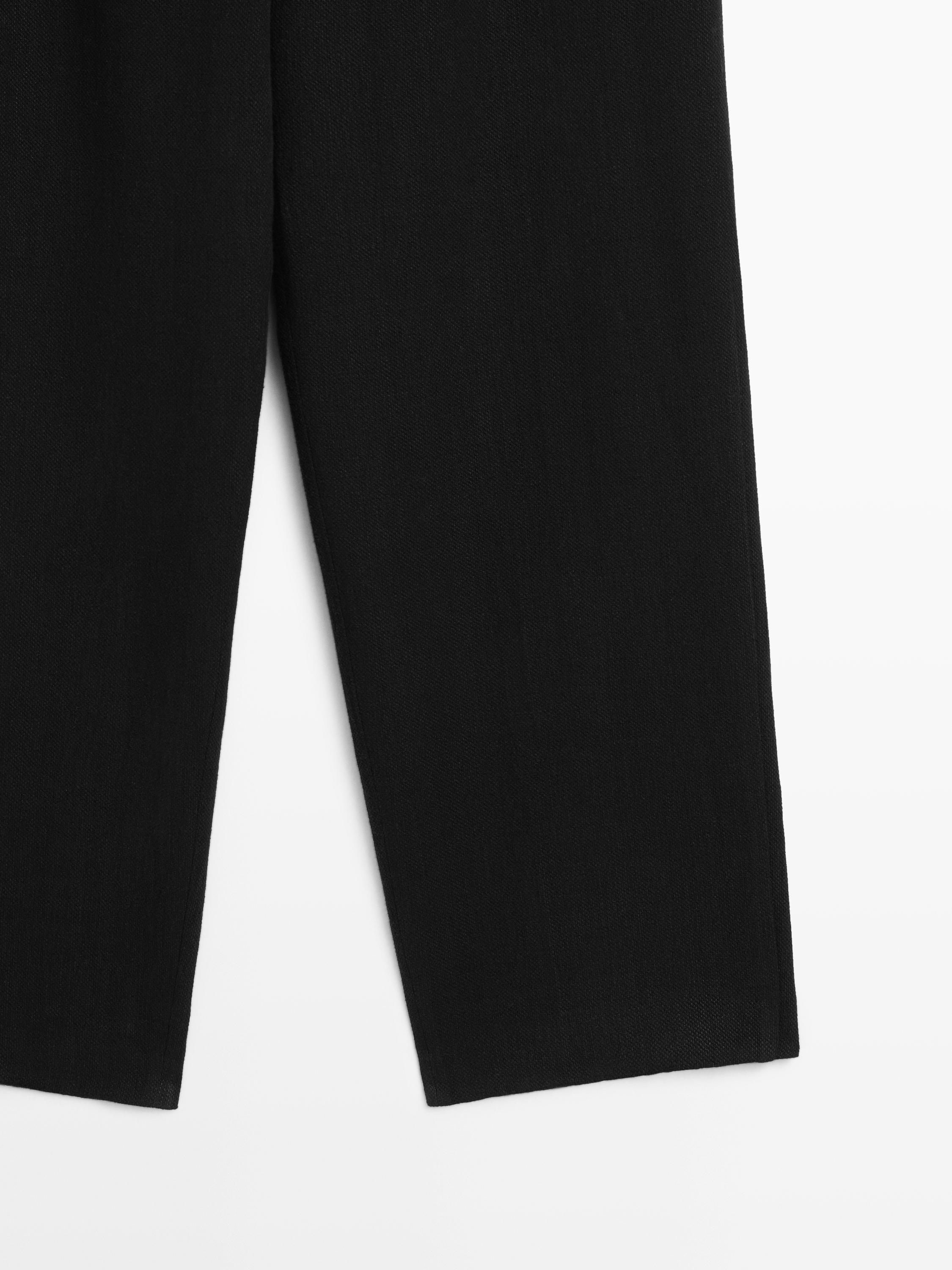 Flowing linen blend trousers with pocket details